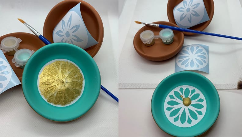 Clay pots with paint and paint brushes