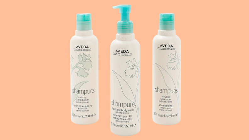 An image of three bottles of Aveda products, including a bottle of shampoo, a bottle of conditioner, and a bottle of hand / body wash.