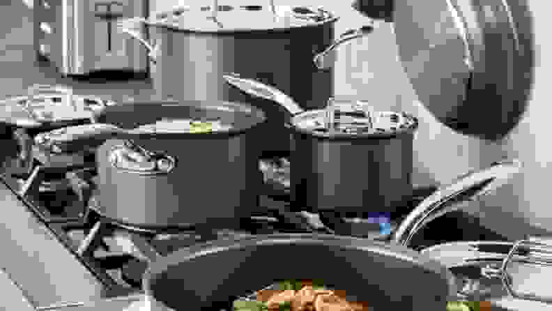 Pots and pans cooking on a stove