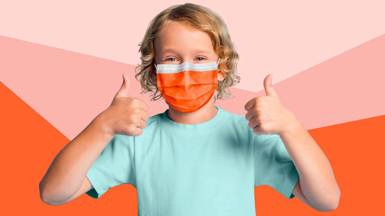A child wears an orange surgical mask.