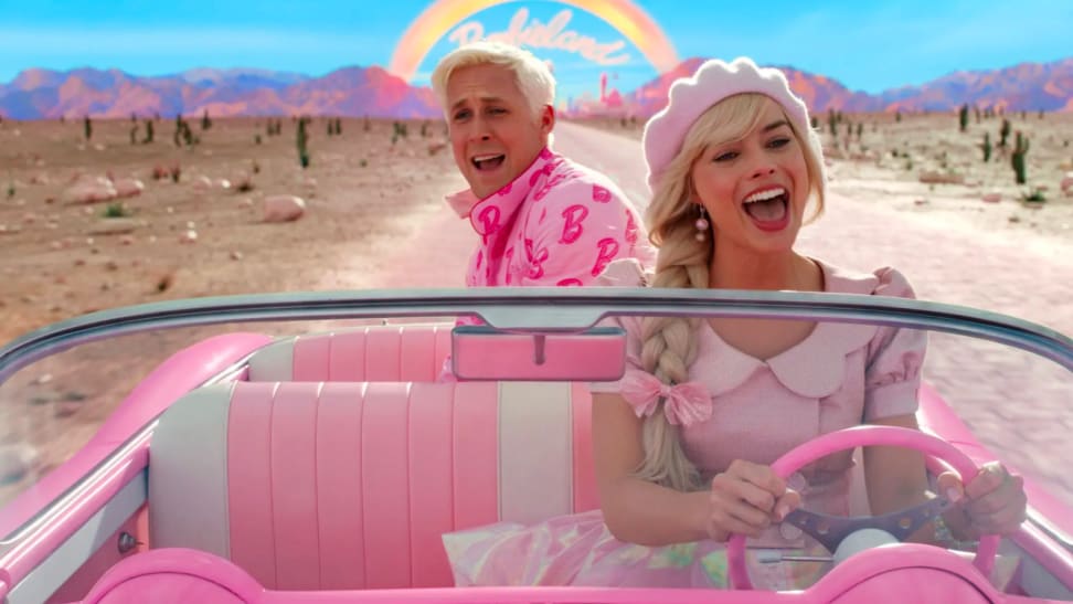 一个n image of Ryan Gosling and Margot Robbie as Ken and Barbie in a pink convertible in the film 'Barbie.'