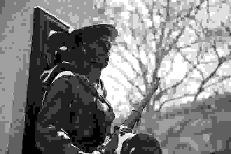 A photo of a statue of a soldier taken during winter storm Juno.