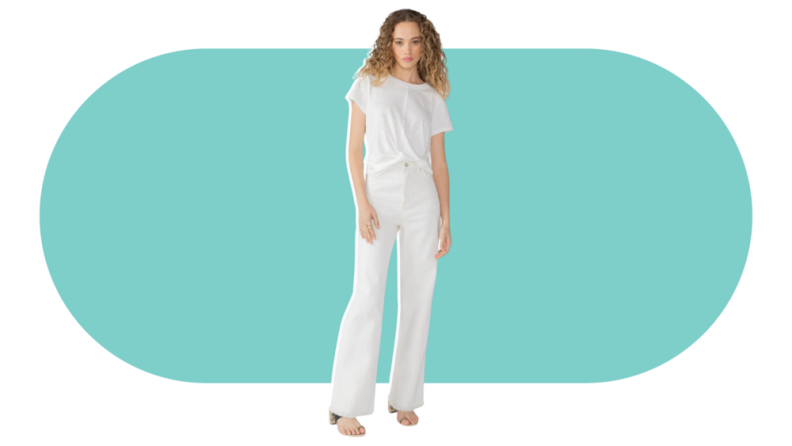 A model wearing the Sanctuary Flashback Wide Leg High Rise Jean in white.