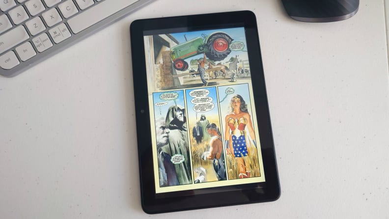 A page of comic book is displayed on an Amazon Kindle Fire HD 8.
