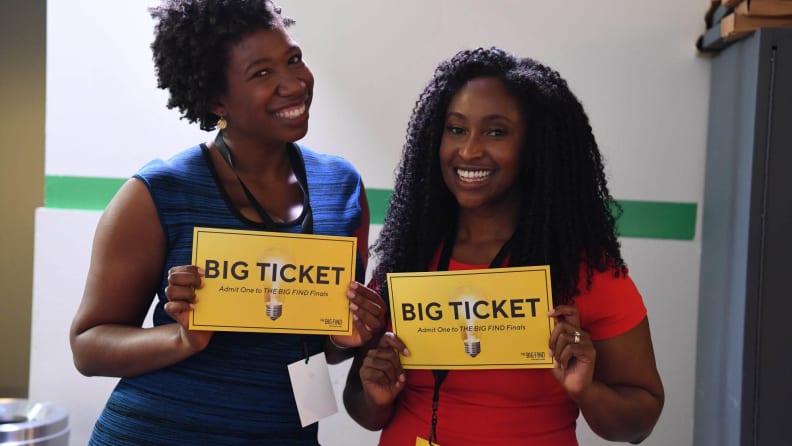 Two black women holding signs reading "Big Ticket"