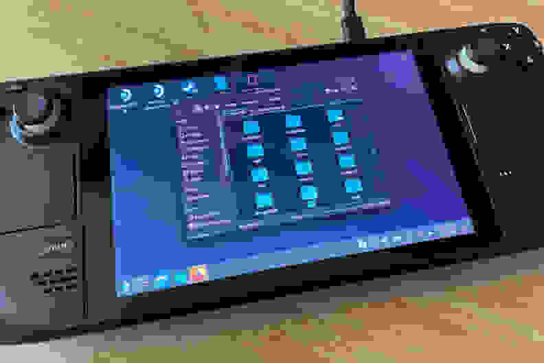 A computer directory with many blue folders showing on the screen of black handheld gaming console