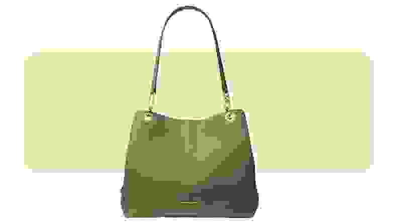 A large green leather bag with gold hardware.