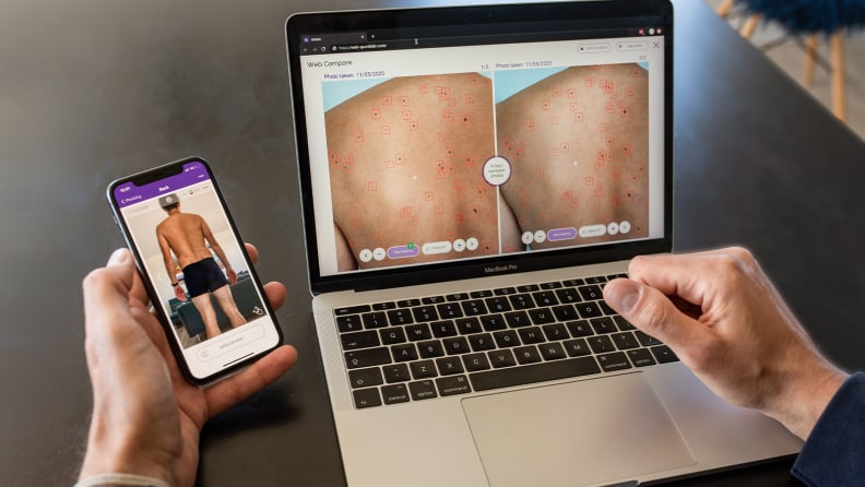 A person uses the MiiSkin app on a MacBook Pro.