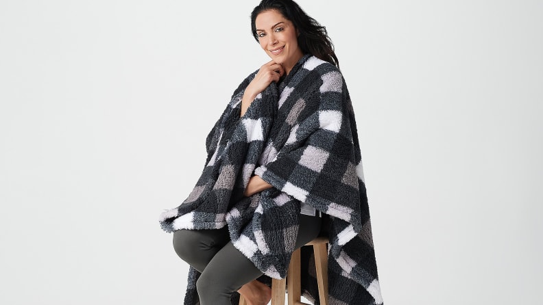 Woman wearing checkered cape