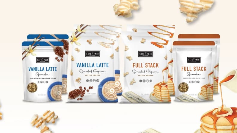 An assortment of packaged food items, including pancake-flavored granola and popcorn, and vanilla latte-flavored granola and popcorn.