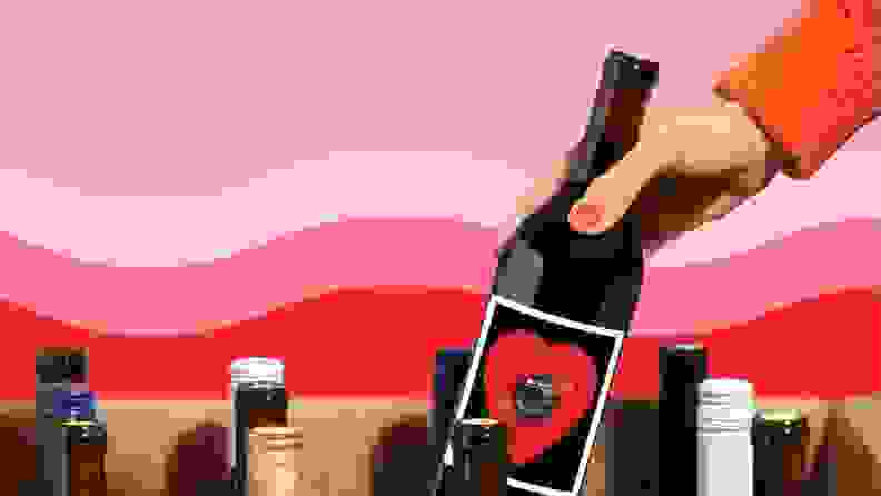 A hand picking a bottle of wine out of a box of wine bottles, with a pink and red background.
