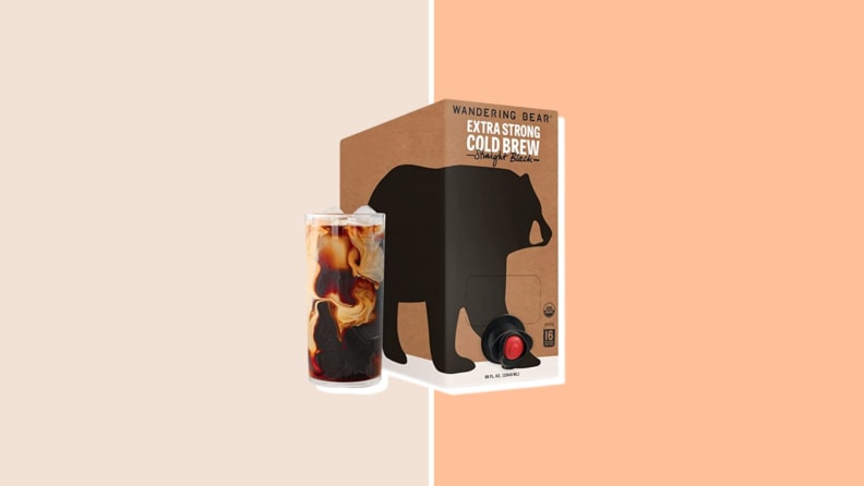A package of Wandering Bear coffee blend with a full glass of coffee served next to it.