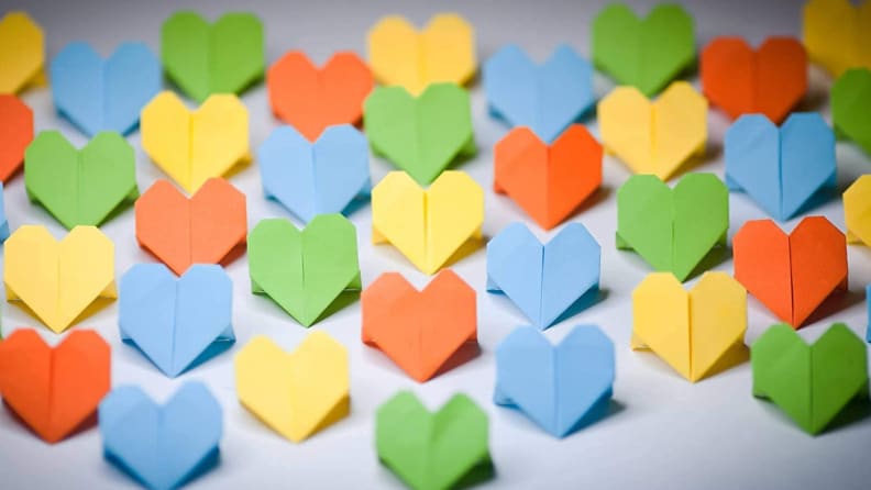 Multicolored origami hearts in a group.