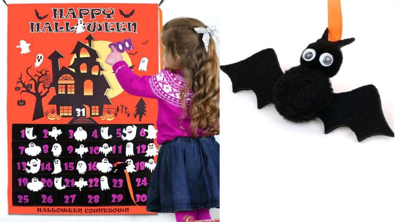 Young child playing with Halloween-themed calendar.