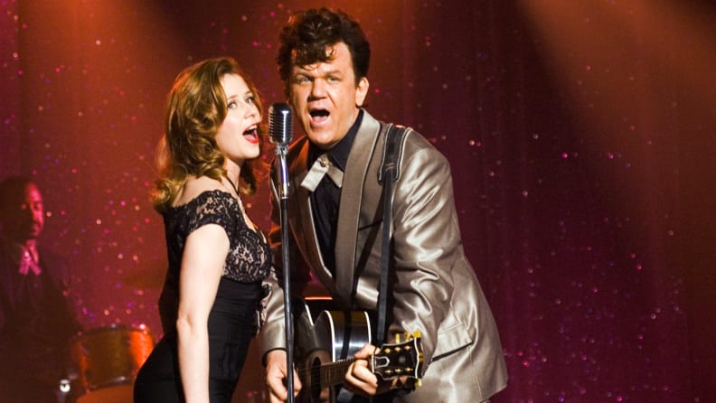 Actors John C. Reilly and Jenna Fischer perform a duet onstage in the 2007 musical comedy Walk Hard: The Dewey Cox Story.