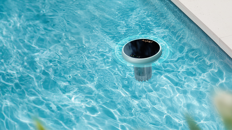 A round circular device floats in a pool