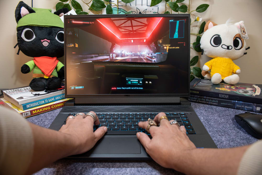 A first person POV of someone playing a game on a laptop