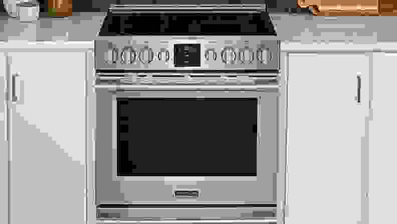 Frigidaire Professional PCFE3078AF surrounded by white cabinets