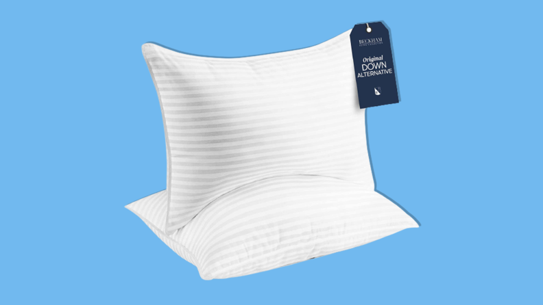 Beckham Hotel Collection Gel Pillow on blue background.