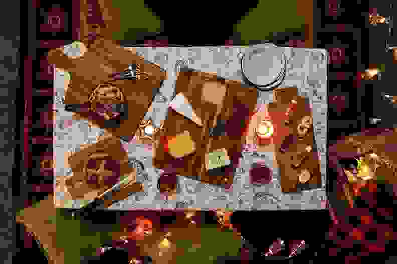 Several wooden cutting boards topped with food, shot from above