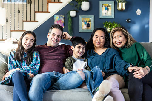Portrait of multi-generational family on couch at home