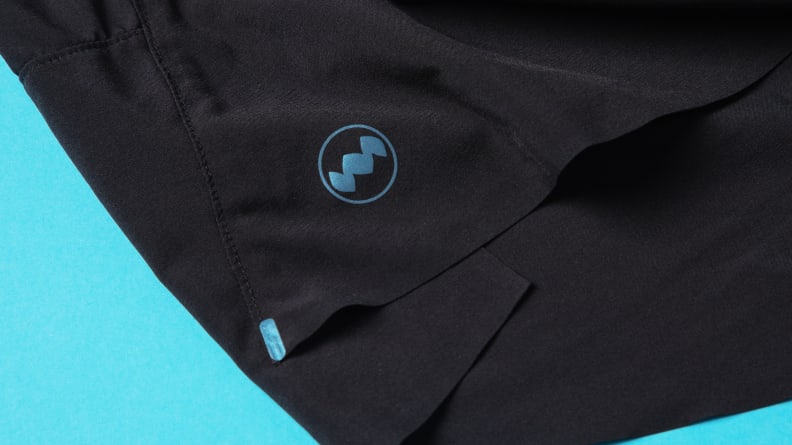 Reflective material on a pair of black Janji running shorts.