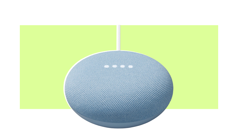 A Google Nest Mini smart speaker on a colorful background