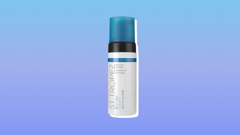 St. Tropez Self Tan Classic Bronzing Mousse self-tanner against a blue and purple background.