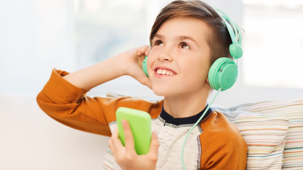 Boy listening to podcast on headphones