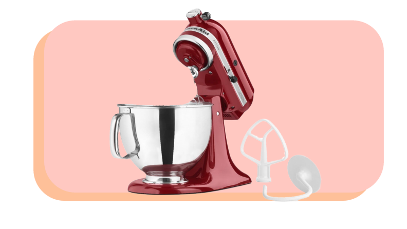 Red standing mixer with stainless steel mixing bowl next to two interchangeable attachment pieces.
