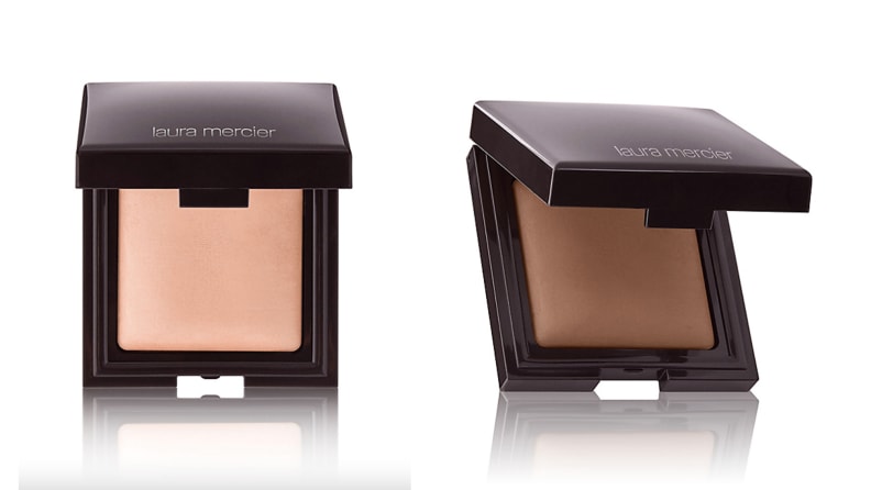 On the left: The Laura Mercier Candleglow Sheer Perfecting Powder compact open to reveal a fair shade. On the right: The compact is open to reveal a dark shade.