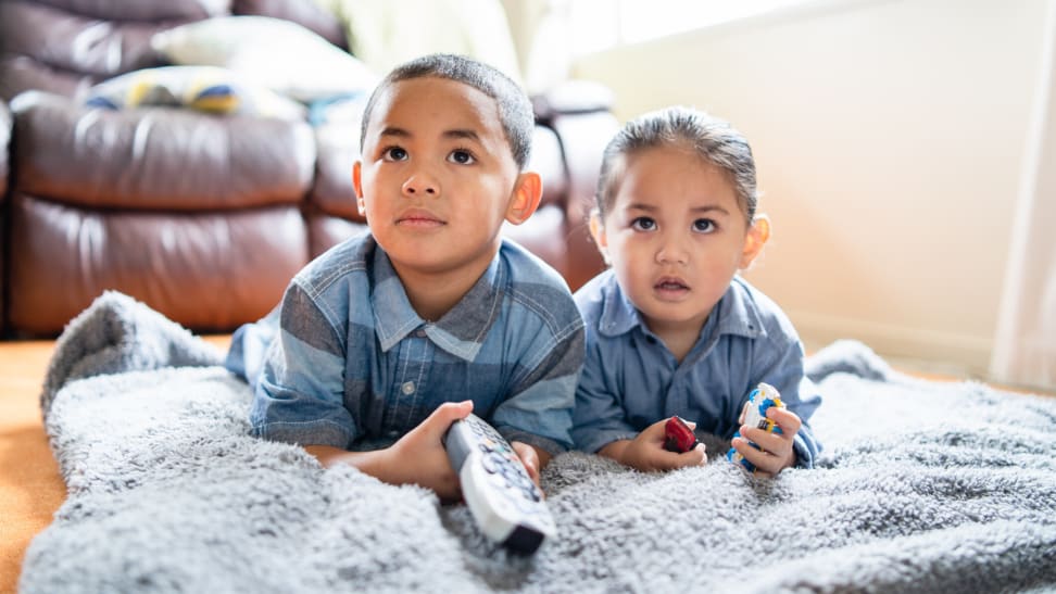 Two kids watching TV