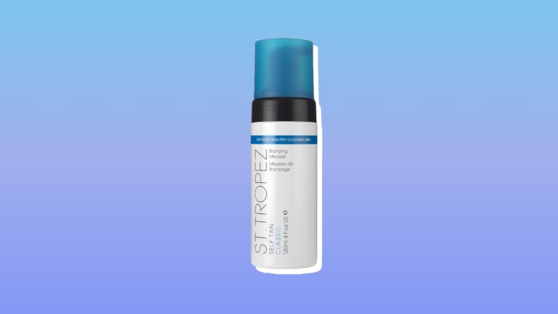 St. Tropez Self Tan Classic Bronzing Mousse self-tanner against a blue and purple background.