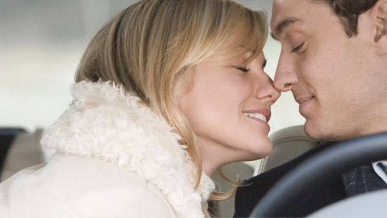 Cameron Diaz leans in to kiss a smiling Jude Law behind the wheel of the car in 2006's The Holiday, which also stars the likes of Jack Black, Kate Winslet, John Krasinsky, and Rufus Sewell.