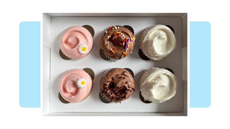 Top view of a box with different flavors of cupcakes.