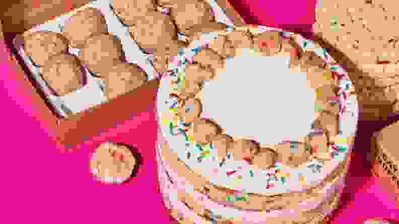 Funfetti birthday cake, funfetti cookies, and funfetti truffles on a neon pink surface.