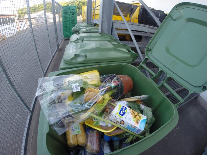 A trash barrel full of fresh food.