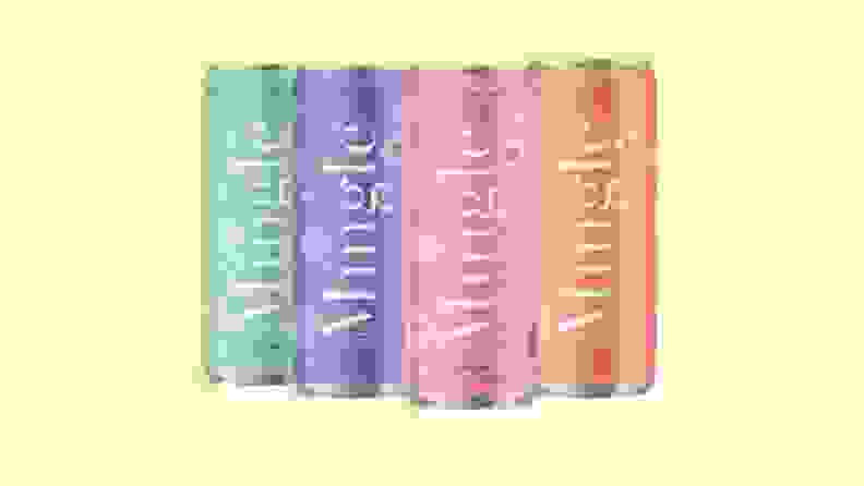 Four colorful Mingle Mocktail cans on a bright yellow background