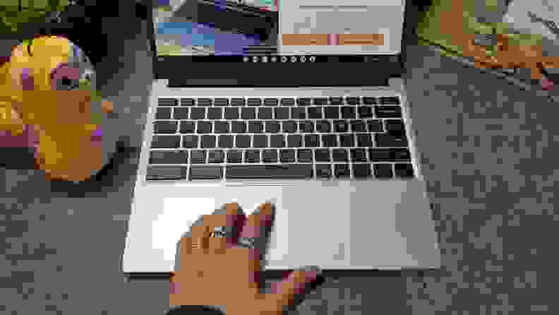 A person using the mouse pad on the Framework Laptop Chromebook.