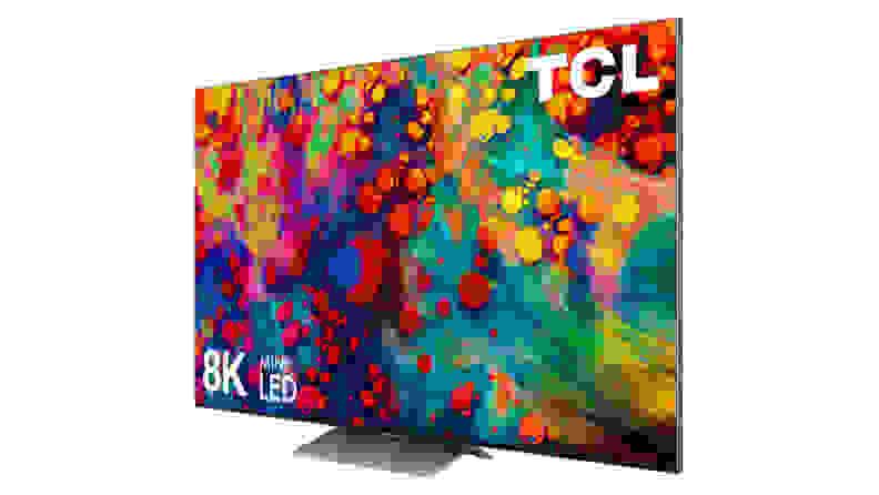 A massive 8K TCL television is shown at an angle, colorful swirls of paint on the display.