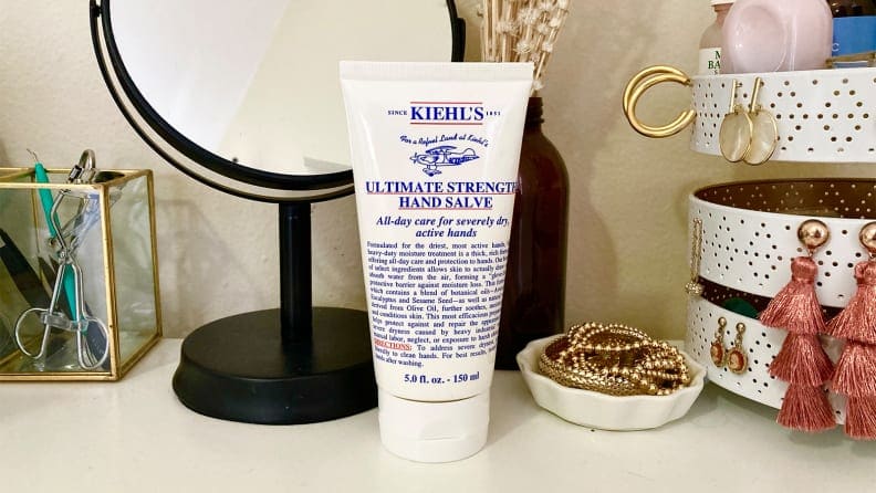 Kiehl's hand salve on a desk.