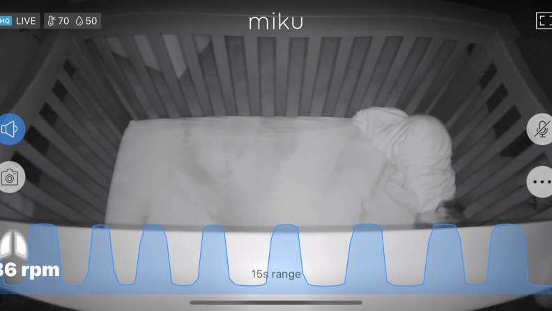 Screenshot of video feed of baby sleeping in crib at night from the Miku Pro Baby Monitor.