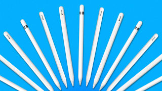 A row of Apple Pencils on a blue background.