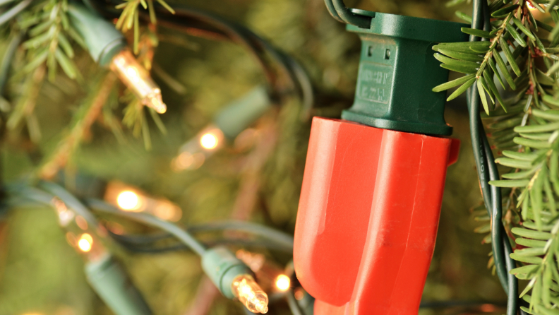 Extension cord attached to the end of a Christmas light
