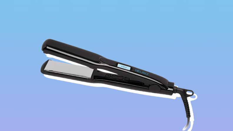 Paul Mitchell flat iron against a blue background.