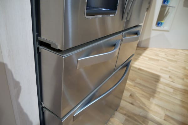 The twin handles maintain the fridge's balanced aesthetic.