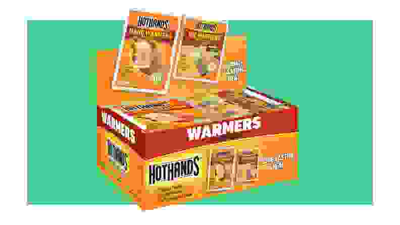 Box of Hot Hands hand and toe warmers on a green background
