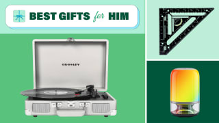 A vintage style Crosley record player, a square tool, and a rainbow-lighted table lamp