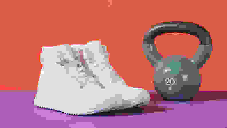 white sneakers next to 20 pound weight