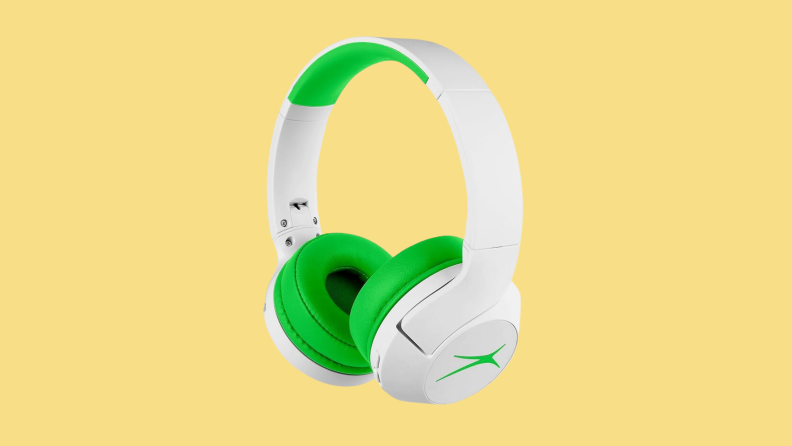 Green and white headphones on a yellow background.